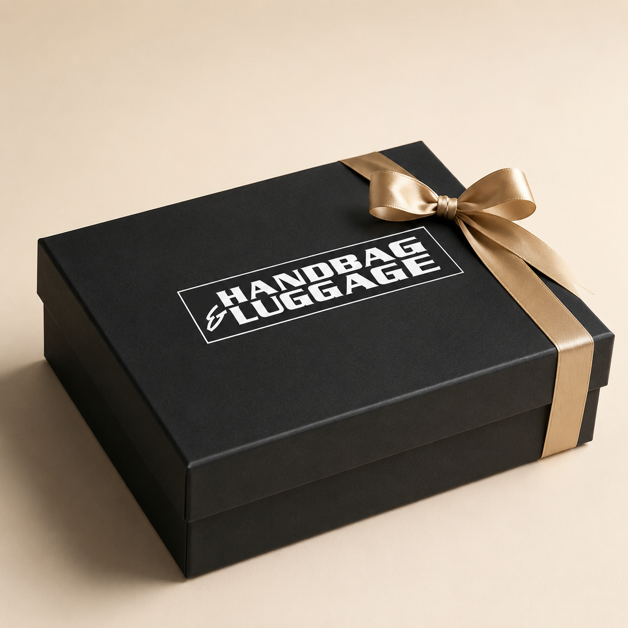 Black corporate gift box with gold ribbon and Handbag & Luggage logo