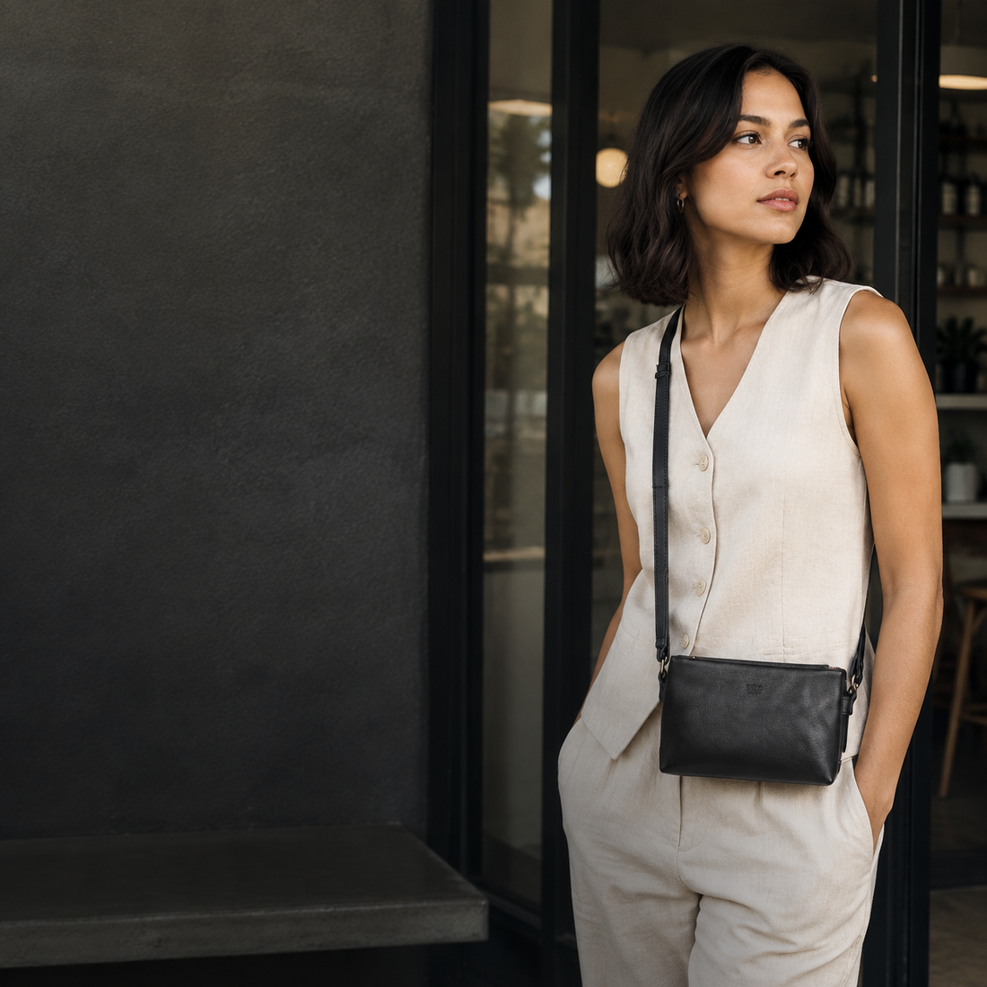 Woman wearing the Polo Vega Small Sling in black